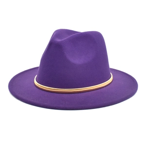 Detailed view of dark purple wool fedora hat featuring a slim gold decorative band