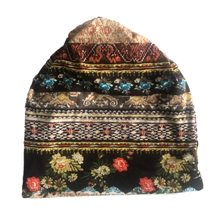 Detail of bohemian knit slouchy beanie with colorful ethnic geometric patterns