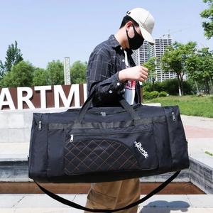 Large black Oxford travel bag with diamond quilt pattern and detachable shoulder strap