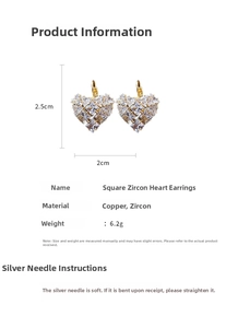 Macro detail of heart hoop earrings featuring square-cut zircon and copper base in gold