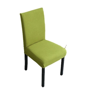 Green stretch chair cover with waffle texture for dining chairs, professional studio shot