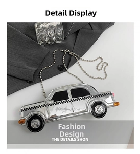 Detail view of silver car-shaped shoulder bag with checkerboard pattern and bead chain strap