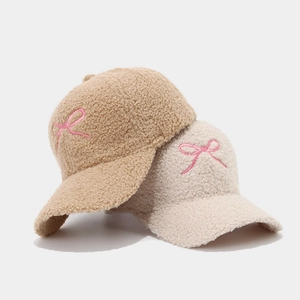 Winter faux lamb wool baseball cap with pink bow embroidery in beige and camel colors
