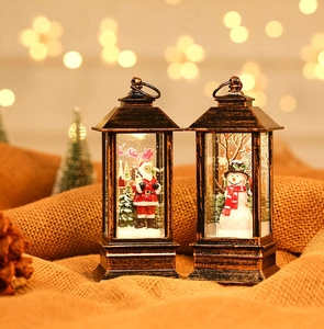 Detail of vintage bronze Christmas lantern with Santa scene and warm bokeh lighting