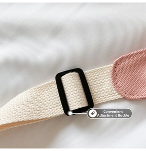 Close-up detail of adjustable strap buckle on kids crossbody bag with canvas fabric