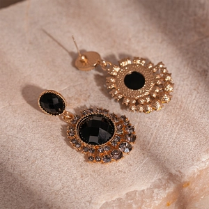 Vintage gold sunflower earrings with black faceted gemstones and grey crystal accents