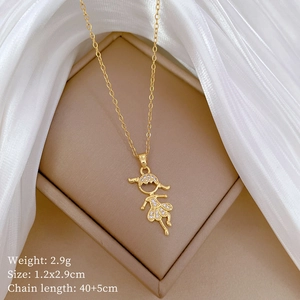 Detailed view of a gold-plated butterfly necklace with micro-pave crystals on a jewelry box