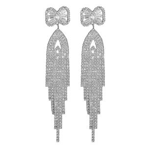 Elegant silver bow earrings with long tassel drops and shimmering cubic zirconia stones