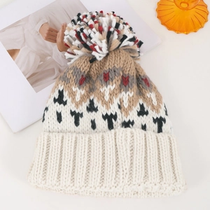 Colorful pom-pom knitted beanie in white and khaki with a stylish patchwork design