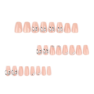 Pink bow press-on nails with shiny rhinestones in a long ballerina shape set of 24