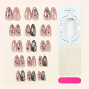 Nude pink cat-eye press-on nails set with silver moon stars and 3D gold glitter accents
