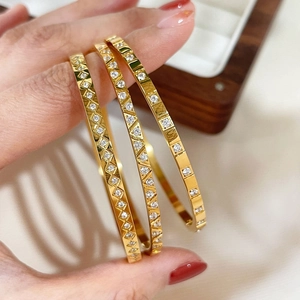 Three-piece gold titanium steel bracelets with geometric diamond patterns and zircon inlay