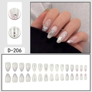 Sweet pink press-on nails with silver butterfly, star designs and pearl accents