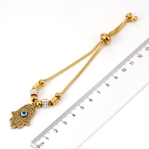 Bracelet en acier inoxydable plaqué or 18K avec main de Hamsa, œil bleu et fermoir coulissant