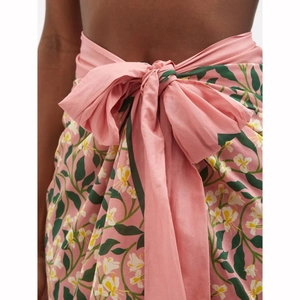Detailed close-up of pink floral beach wrap skirt with elegant waist bow tie