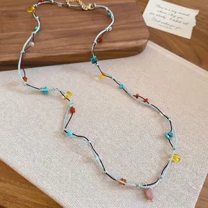 Bohemian double-layered woven rope necklace with turquoise and pink stone pendant