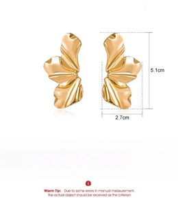 Detail view of large matte gold irregular petal earrings with specific dimensions and weight