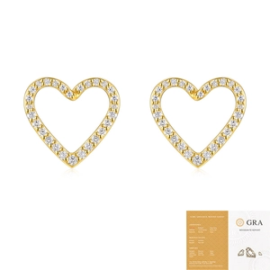 Macro shot of gold heart moissanite studs with GRA certification report document