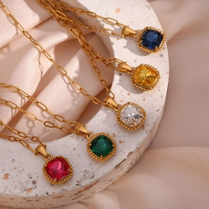 Collection of square gemstone necklaces with gold paperclip chains in five vibrant colors