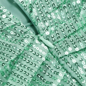 Detail of sequins on mint green evening dress showing the invisible zipper and fine stitching