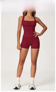 Front view of cherry red seamless yoga set featuring racerback top and high waist shorts