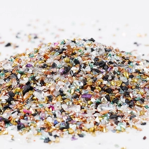 Close-up of irregular multi-colored crushed glass for DIY nail art and home decor