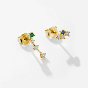 Detailed macro view of S925 sterling silver gold stud earring with colorful zircon stones