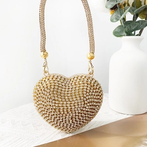 Mini heart-shaped evening bag with gold rhinestones and metallic woven chain handle