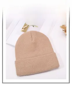 Detailed view of khaki knit beanie with satin lining for hair protection and warmth