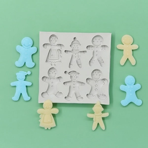 Silicone snowman and gingerbread man baking mold with finished fondant figures