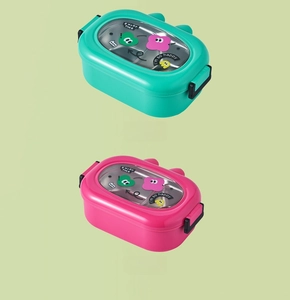 Detail view of pink and green divided lunch boxes with 304 stainless steel interior