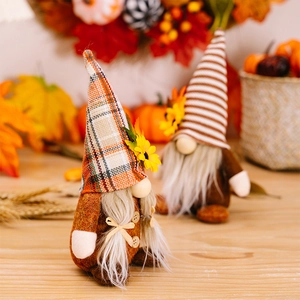 Macro detail of plush Thanksgiving gnomes with autumn sunflowers and maple leaf accents