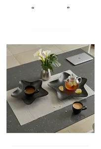 Macro shot of minimalist star-shaped iron tray with matte black finish for home decor