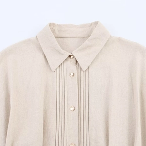 Linen V-neck button-down maxi dress with gold buttons and pleated front details