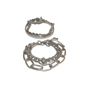 Silver metal chain bracelet set featuring layered O-ring design and lobster clasp style