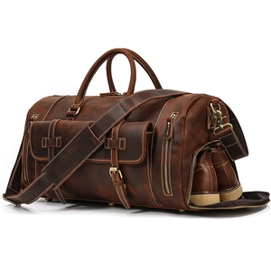 Detailed side view of vintage leather travel bag showing a separate shoe compartment