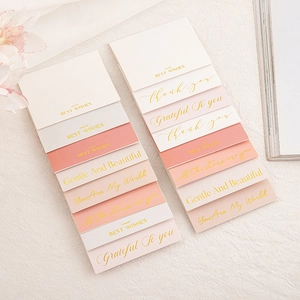 Detail of pink and beige gold foil greeting cards with inspirational English quotes