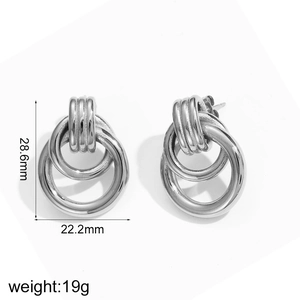 Detail view of interlocking silver hoop earrings with precise size and weight measurements