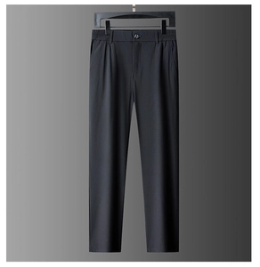 Detailed view of black straight-leg trousers with elastic waist and premium drape texture