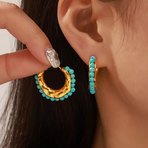 Elegant gold titanium steel C-shaped hoop earrings featuring blue turquoise stone beads