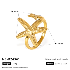Detail of golden starfish ring showing size specifications and stainless steel material