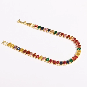 Detailed close-up of colorful marquise-cut zircon stones on a 18K gold-plated tennis bracelet