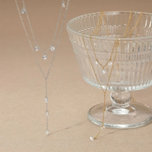 Y-shaped layered stainless steel necklace with sparkling pendants in gold and silver