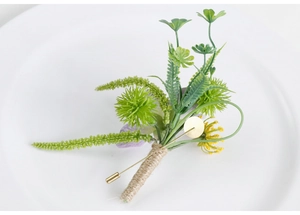Detail of green wedding boutonniere with succulents, yellow flowers and jute twine wrap