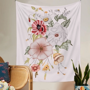 Floral tapestry wall hanging in a cozy living room setting with a wicker chair and plants