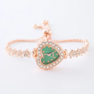 Detail of rose gold square watch with green dial and rhinestones on adjustable bracelet