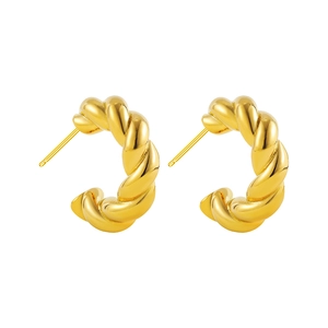 Detailed view of 18K gold plated C-shaped earrings with unique twisted spiral texture
