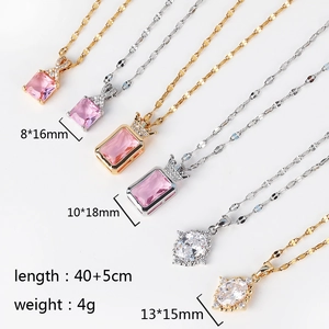 Detail view of gold and silver cross necklaces with pendant sizes and chain length specs