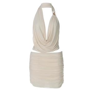 Detail view of beige two-piece set featuring deep V-neck halter top and ruched mini skirt