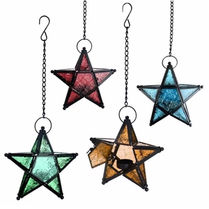 Detailed view of four colorful star-shaped glass lanterns with black metal frames and chains